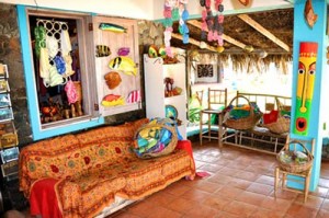 Cozy tropical living room with vibrant decor and natural light.