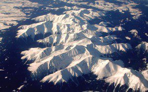 Snow-covered mountain peaks under a clear sky.