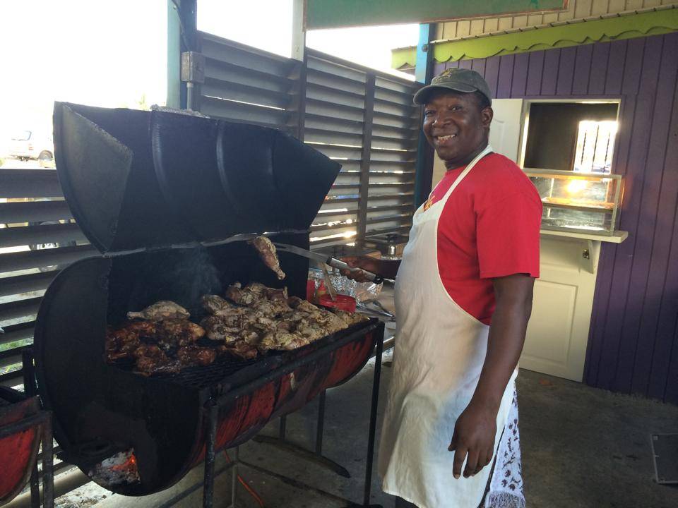 jerk master peter grilling the best barbeque at trellis bay full moon party