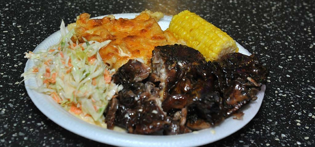 delicious plate of bbq chicken , macaroni pic, corn on the cob and coleslaw available every weekend at trellis bay market