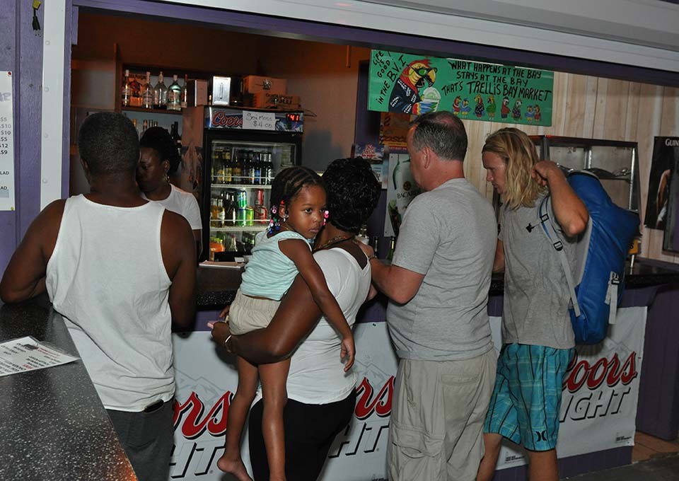 customers awaiting their order at trellis bay market bar and grill