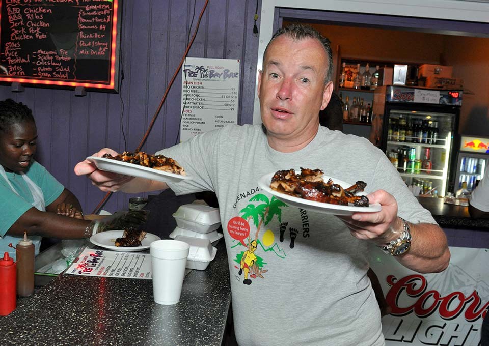 excited customer with orders of bbq at trellis bay