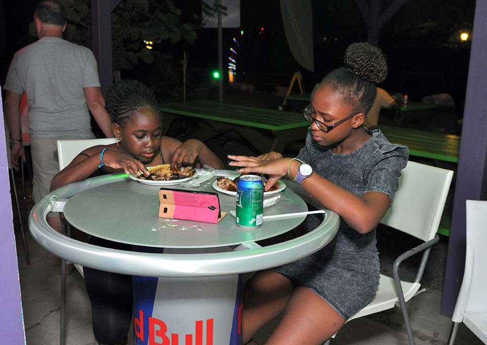 kids enjoying their bbq meal at trellis bay market british virgin islands