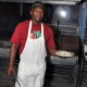 trellis bay market grill master serving grilled fish