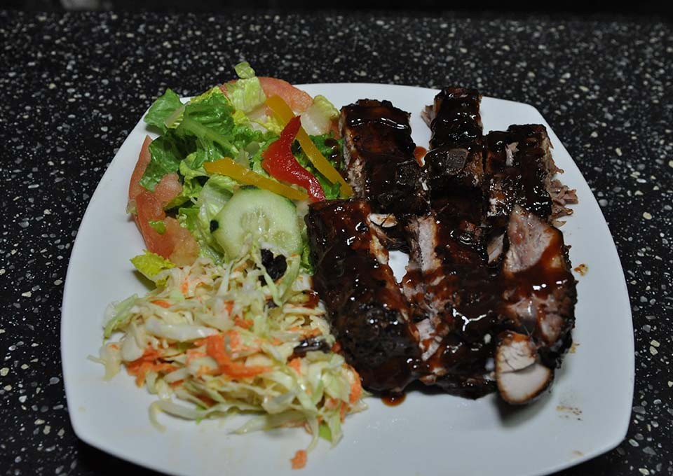 mouth watering bbq ribs, coleslaw and green salad at trellis bay market