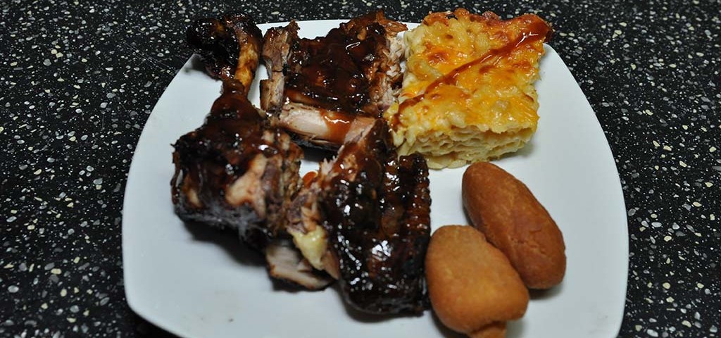 delicious order of bbq chicken, macaroni pie and festivals at trellis bay