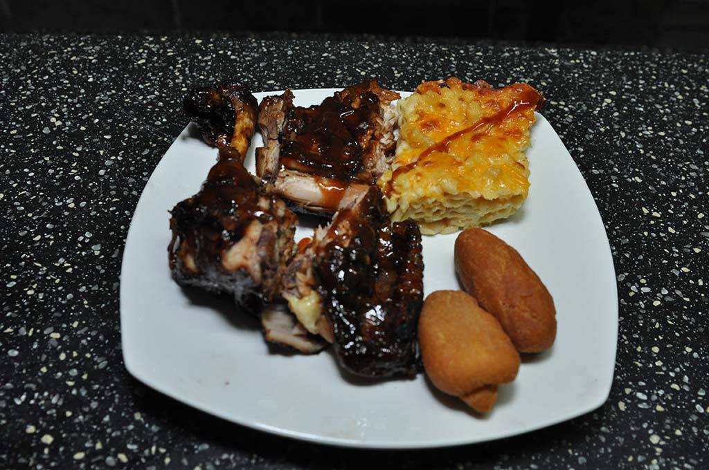 delicious order of bbq chicken, macaroni pie and festivals at trellis bay