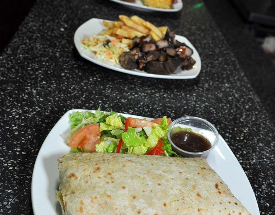 bbq and chicken roti selection at trellis bay market