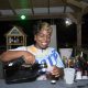 Paula serving a specialty cocktail at carib specials at cheers at vybez & chill at trellis bay market
