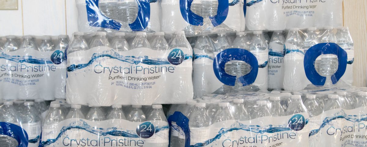 cases of water available at trellis bay market