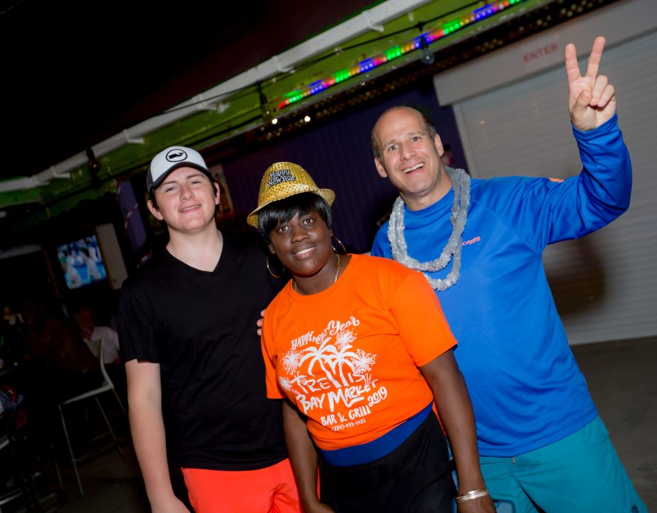 Three people enjoying the party