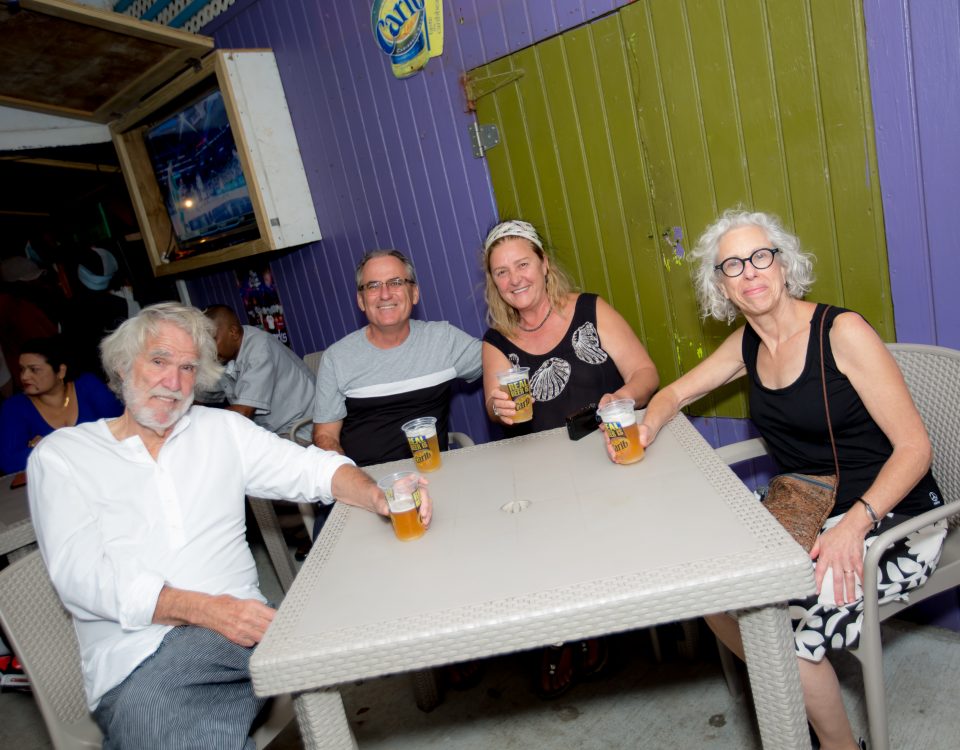A group of elderly people enjoying their drinks