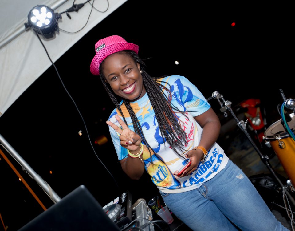A woman making a peace sign