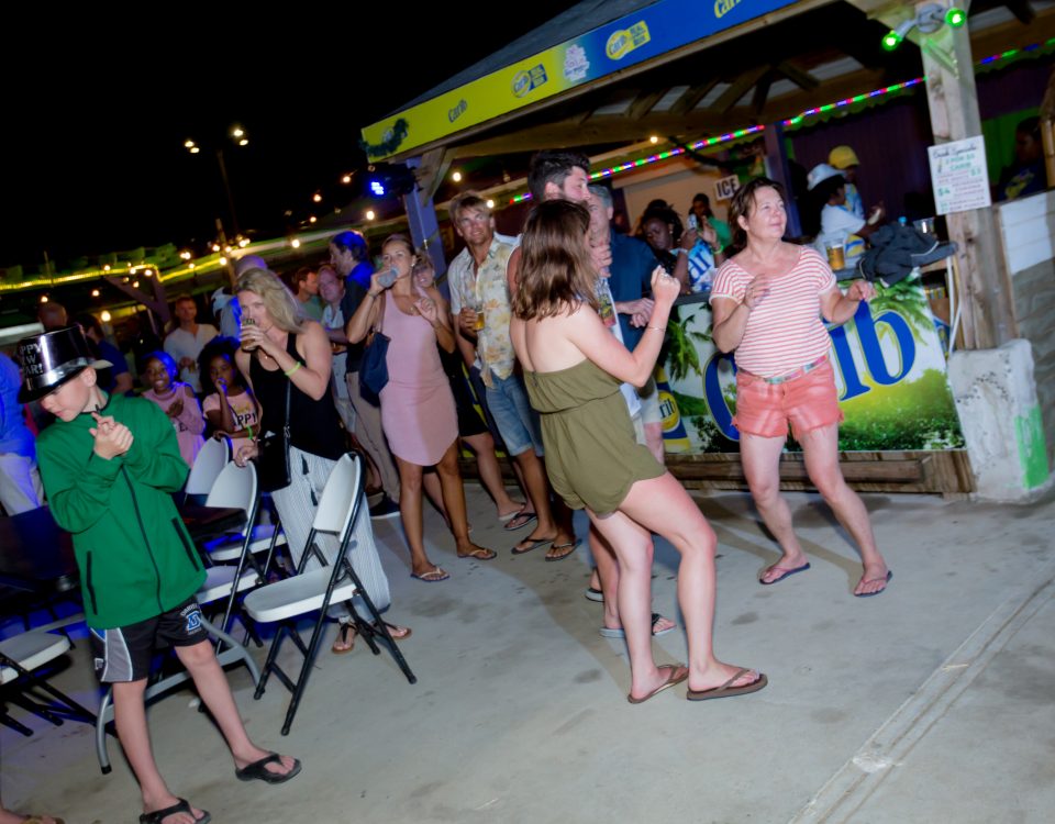 People at the party drinking and dancing