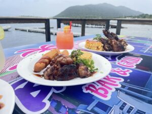 Grilled meats with scenic ocean view dining.
