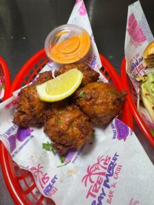 Fried appetizers with lemon and dipping sauce.